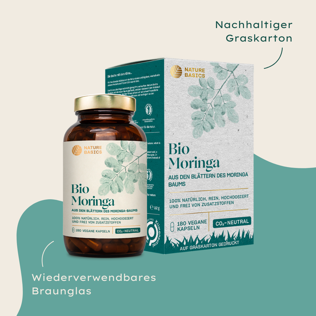 bio moringa kapseln im braunglas und graskarton